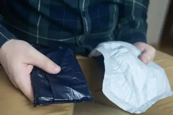 image of man holding stool incontinence Leeds products